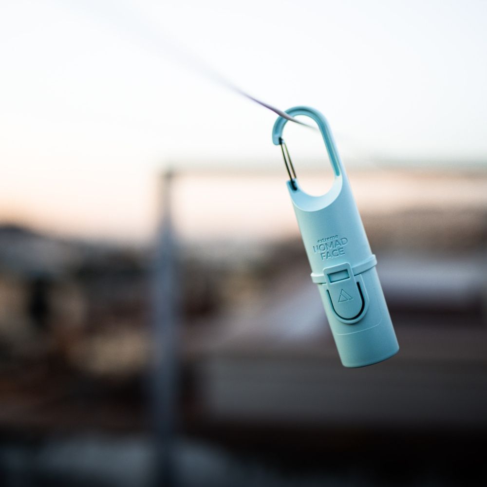 Ridge Capsule clipped to a pack strap
